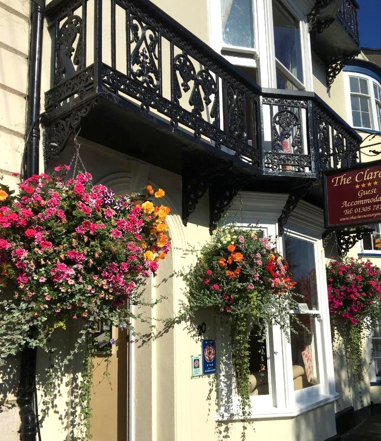 The Clarence, 20 The Esplanade, Weymouth — Victorian town house with hanging sign