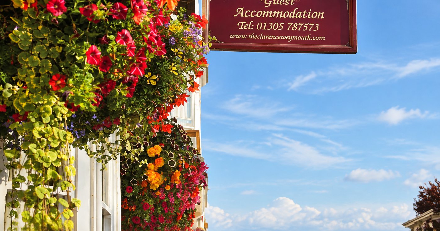 The Clarence hanging sign with flowers